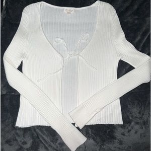 White cardigan by the brand “ultra flirt” (found in Macy’s). Size large